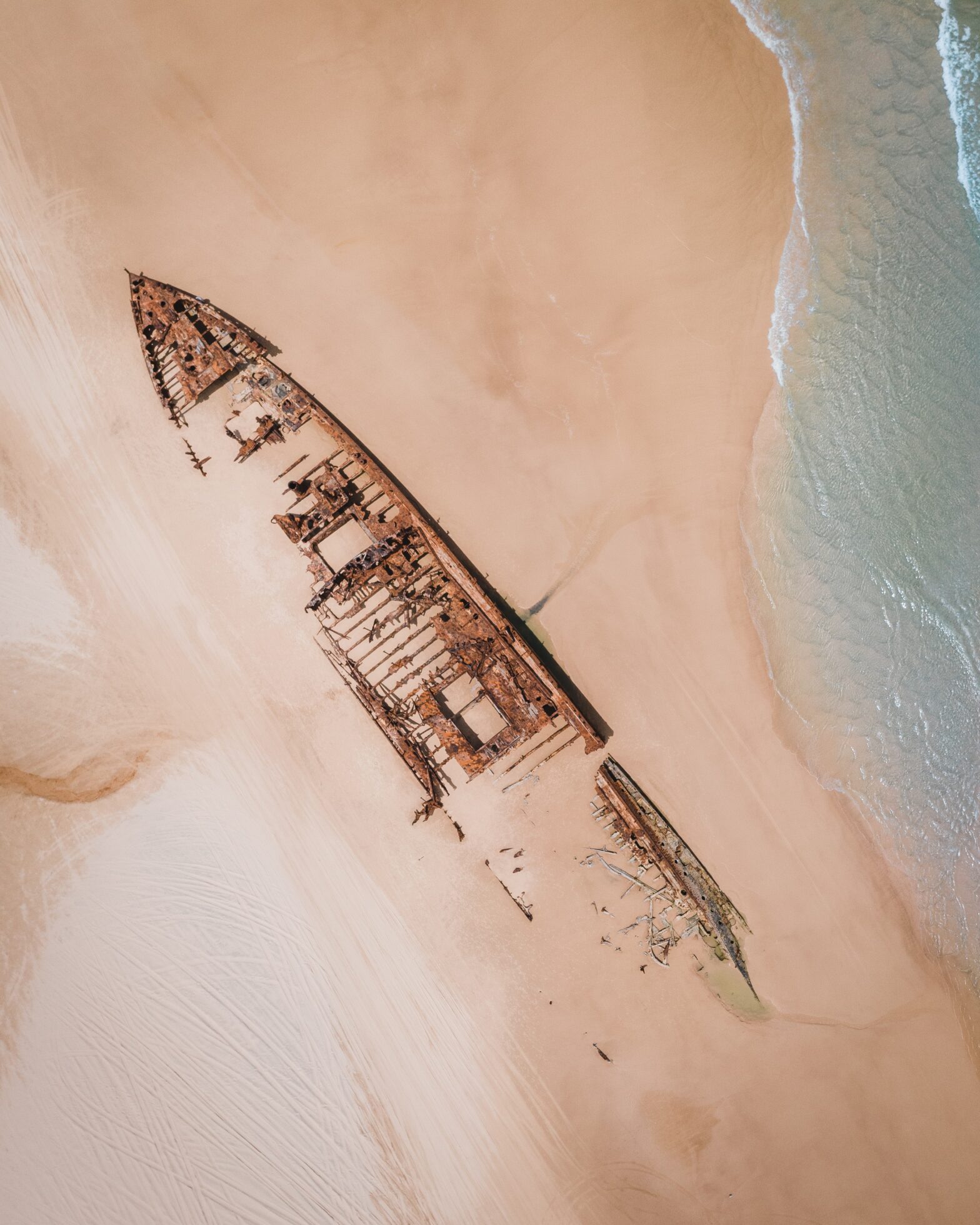 Shipwrecked boat hidden by sand